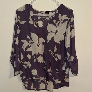 West Kei Alexa Surplice Rolltab Blouse in “Lavender Floral”. 3/4 sleeve.